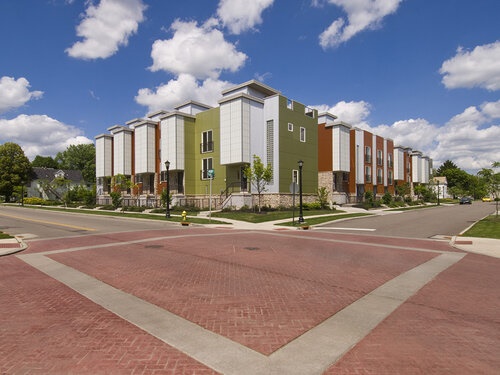 An East Akron development stands against a bright, blue sky.