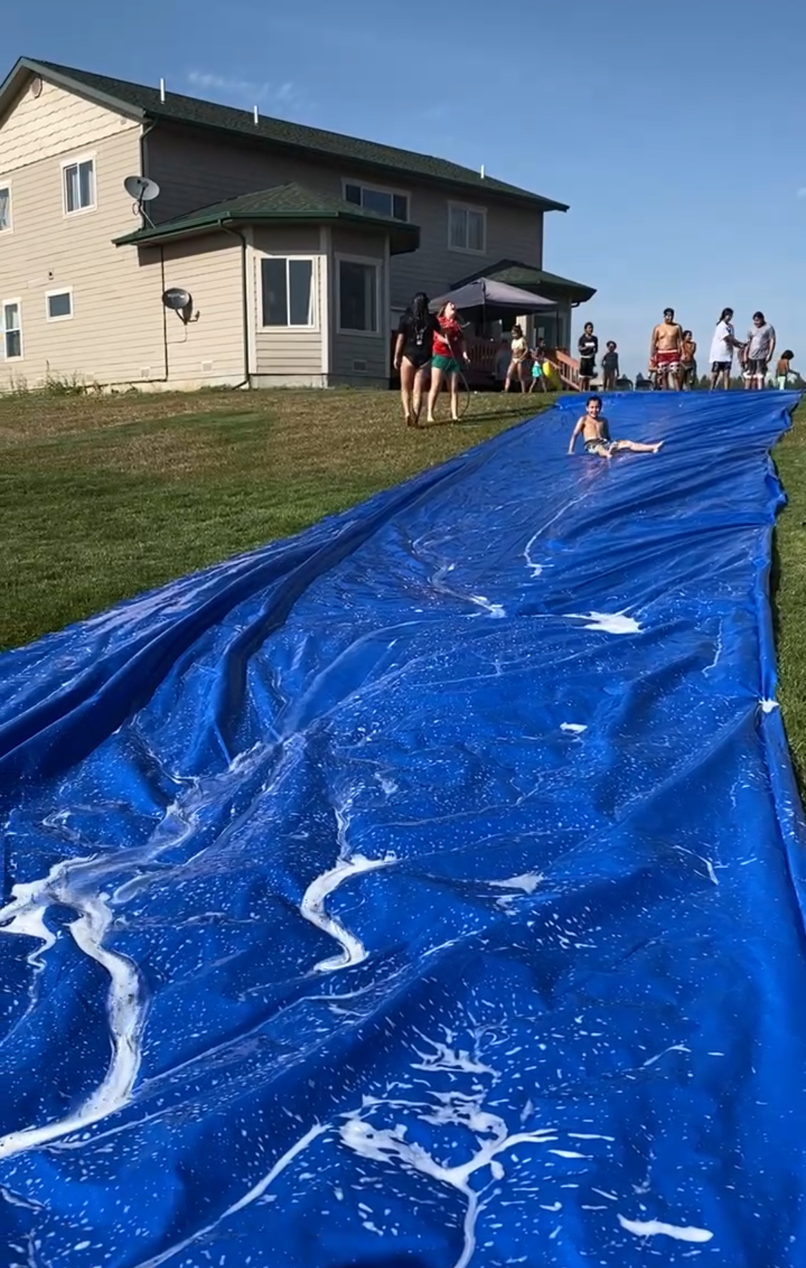 Jody and her family celebrate summer with a water slide.