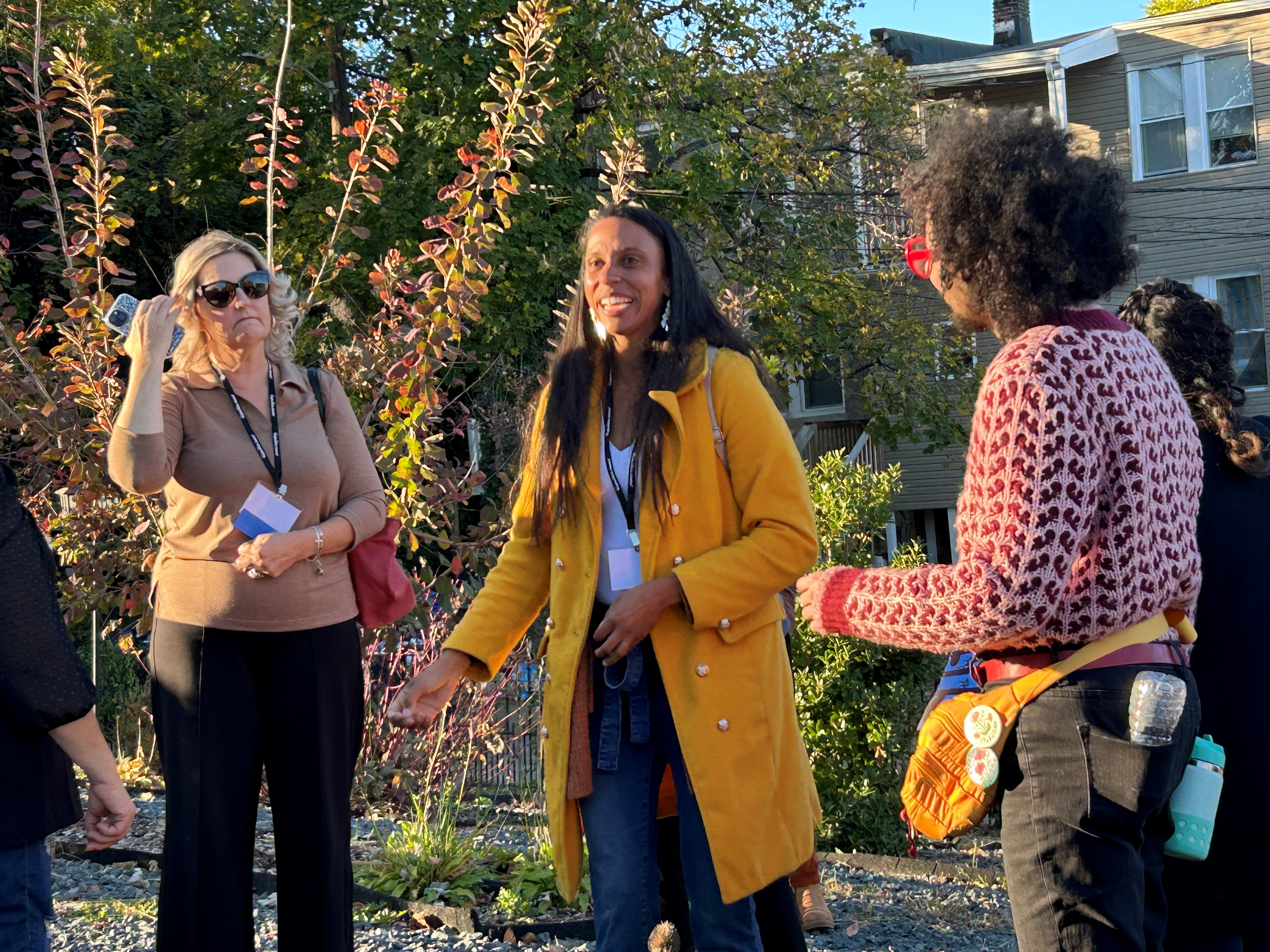 Arica talks to people on a tour of The Urban Oasis space for events and activities.