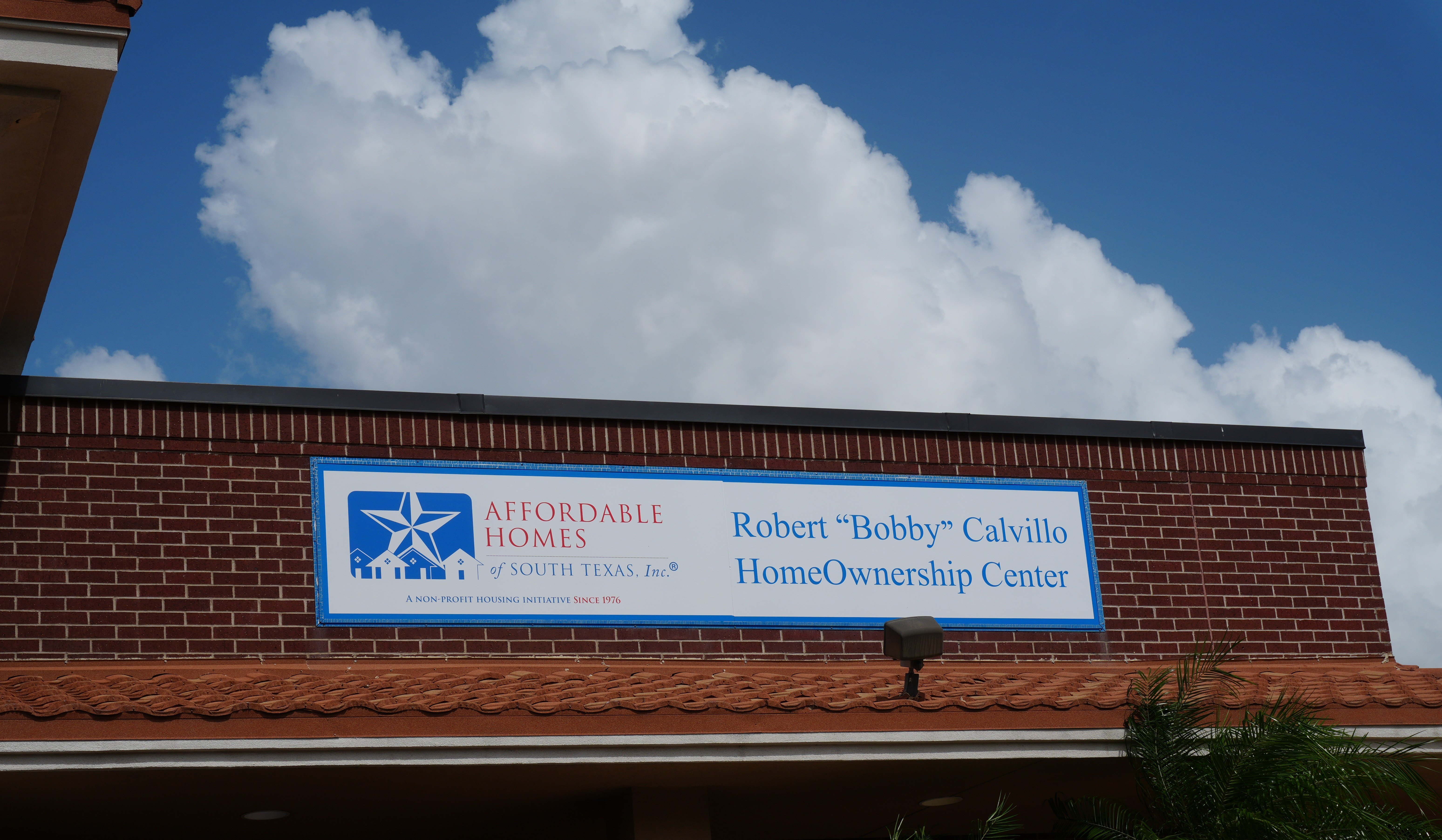 A closeup of the sign for the homeownership center.
