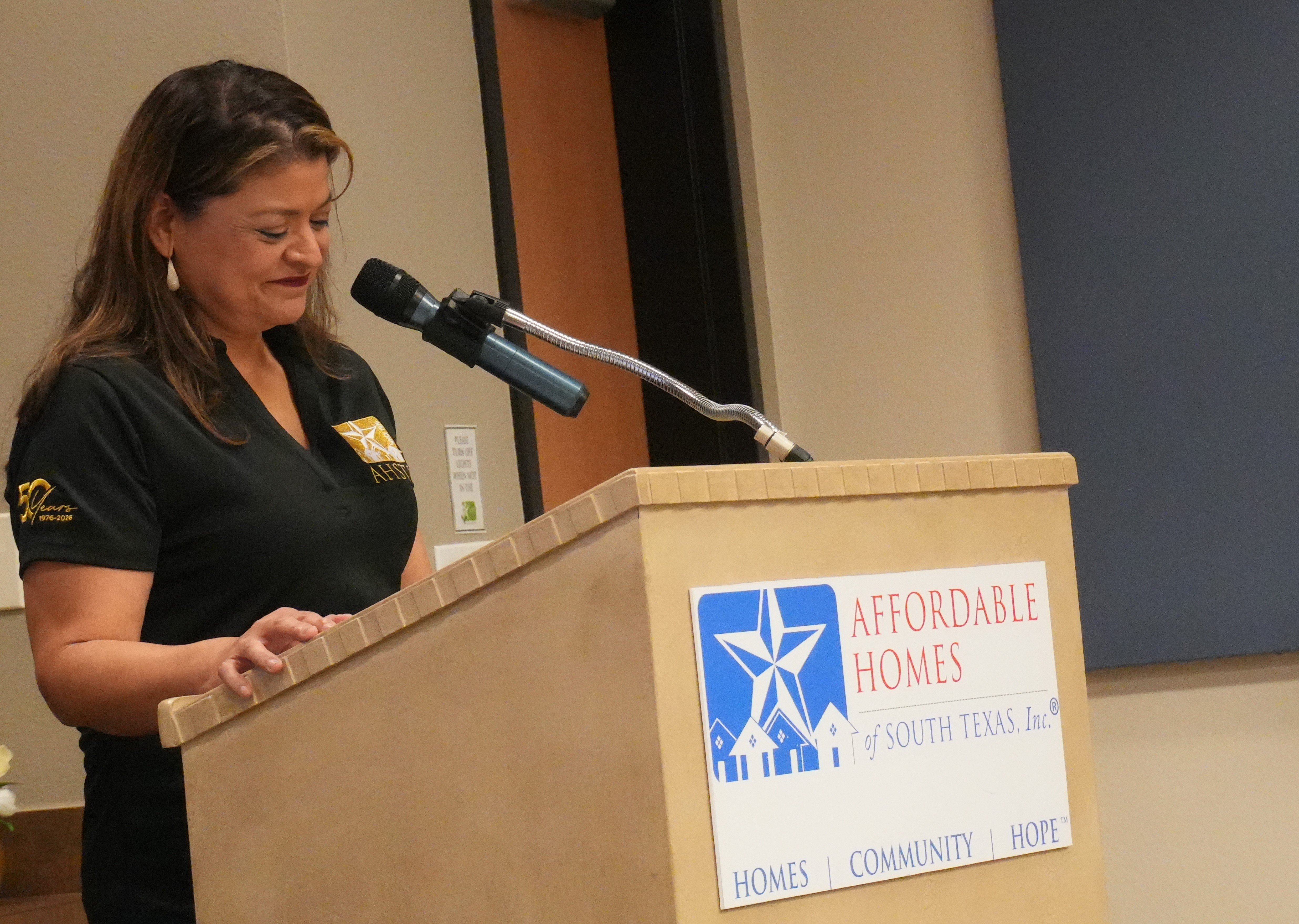 Myra Martinez speaks at the dedication.