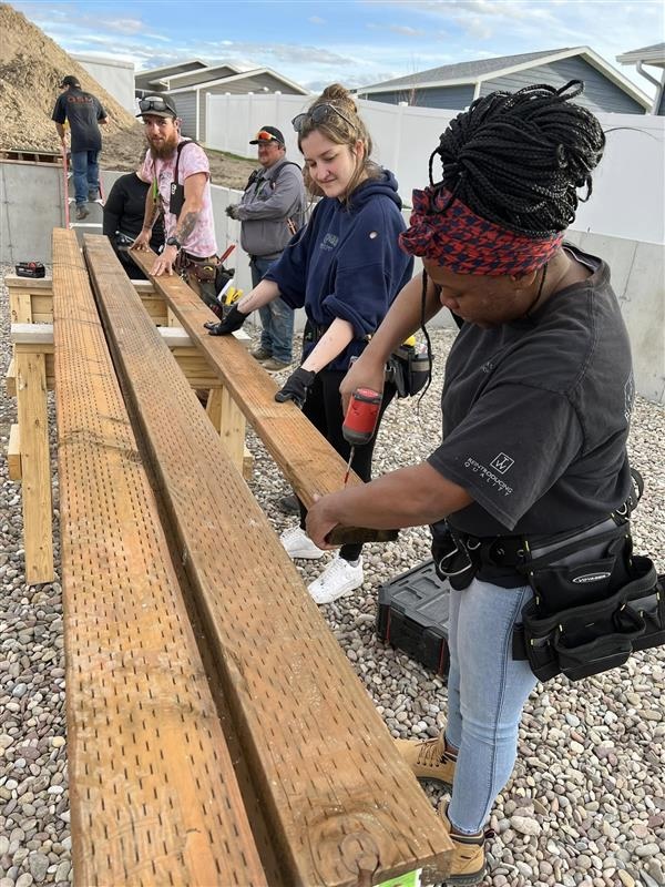 Future homeowners work together in Great Falls. Photo courtesy of NeighborWorks Great Falls.