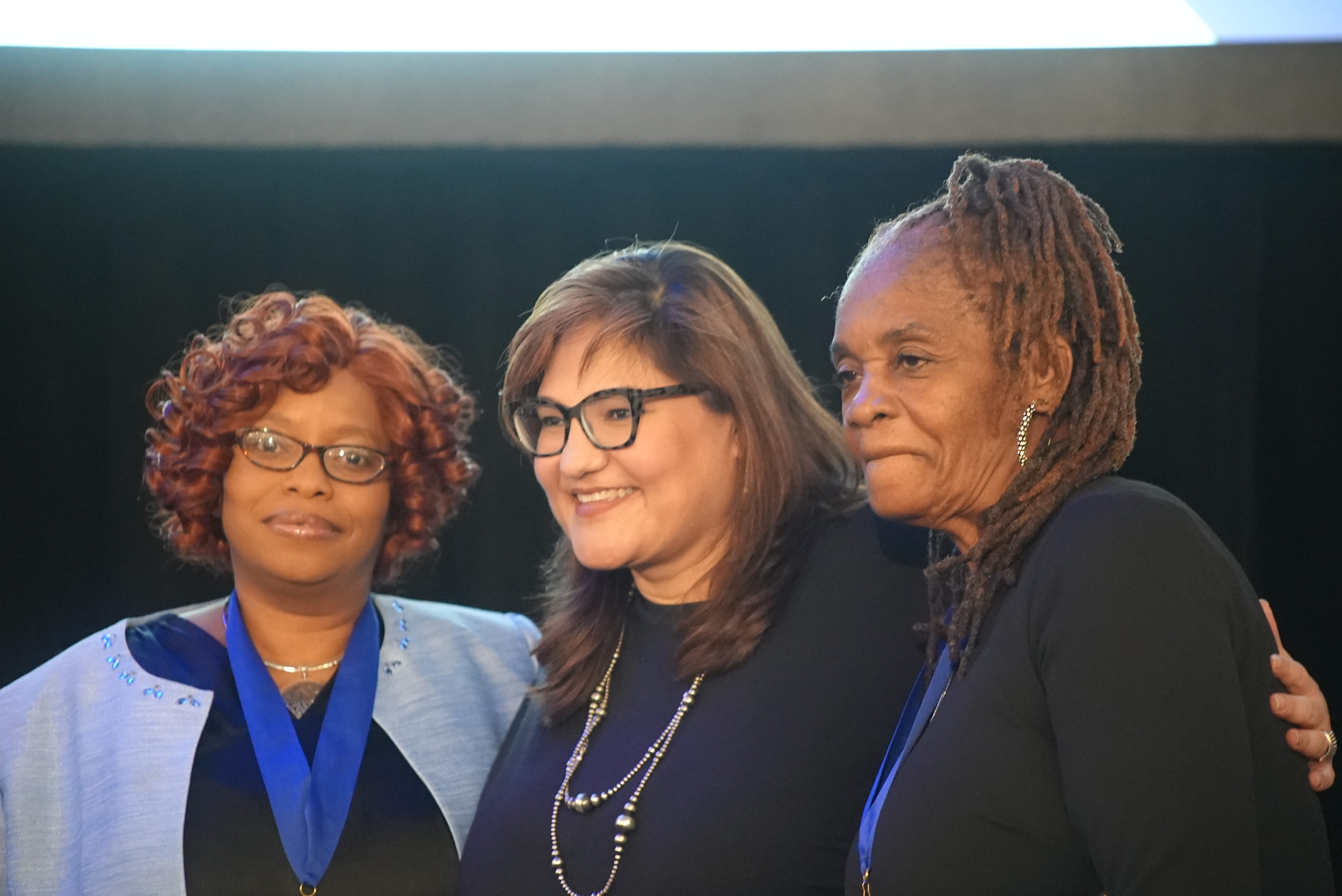 Marietta Rodriguez with Theresa Davis (left) and Monica Underwood.