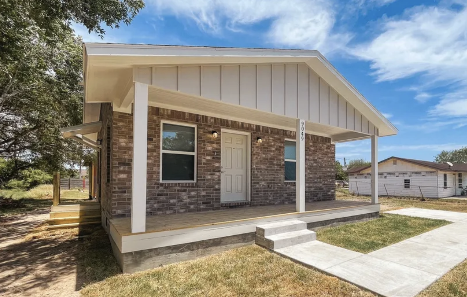 A small brick home constructed by DreamBuild.