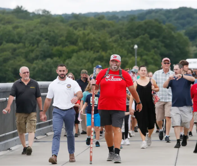 Tommy on his walk across the country, walking stick in hand.