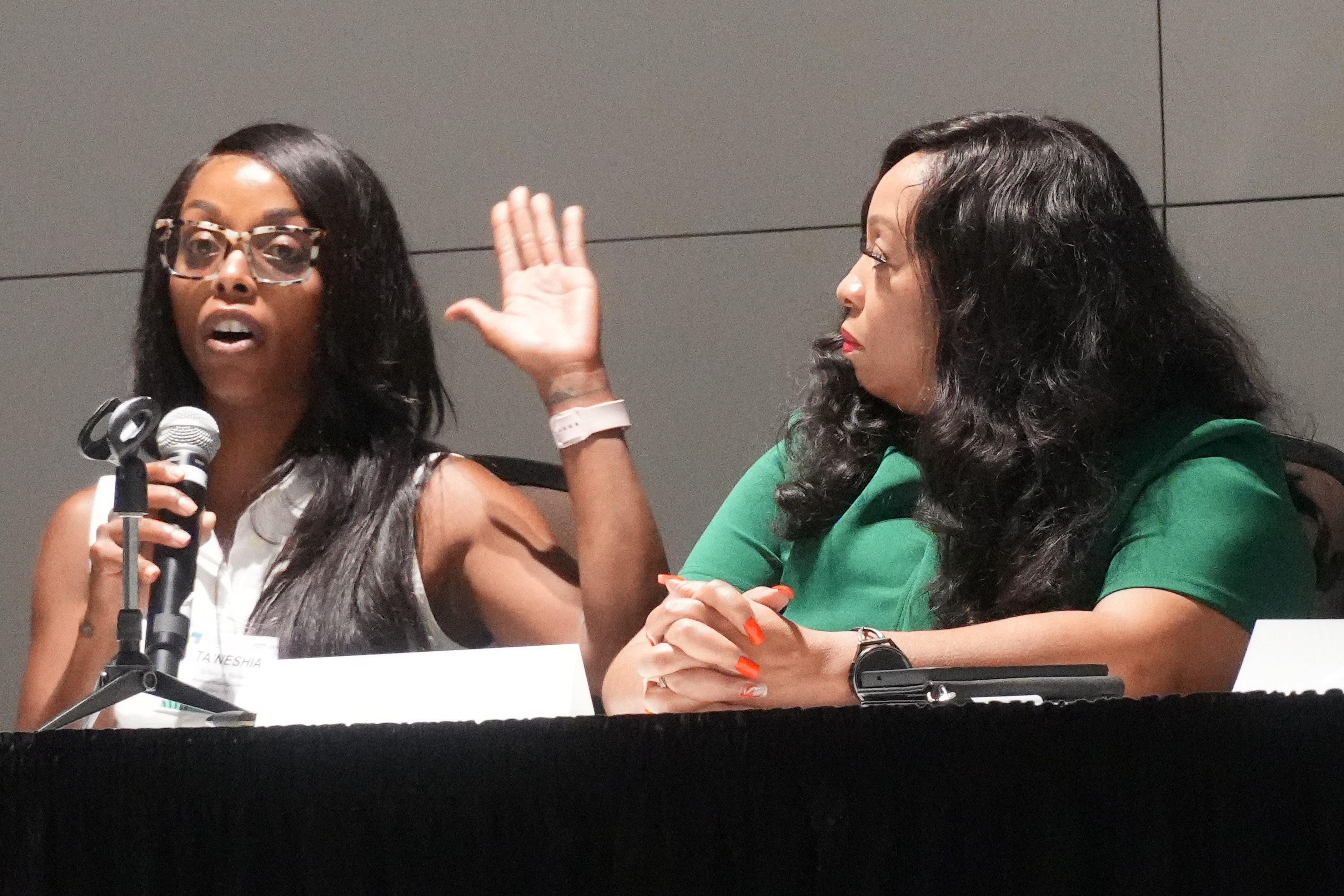 Carrie Davis listens as Ta'Neshia Renae talks about leadership.