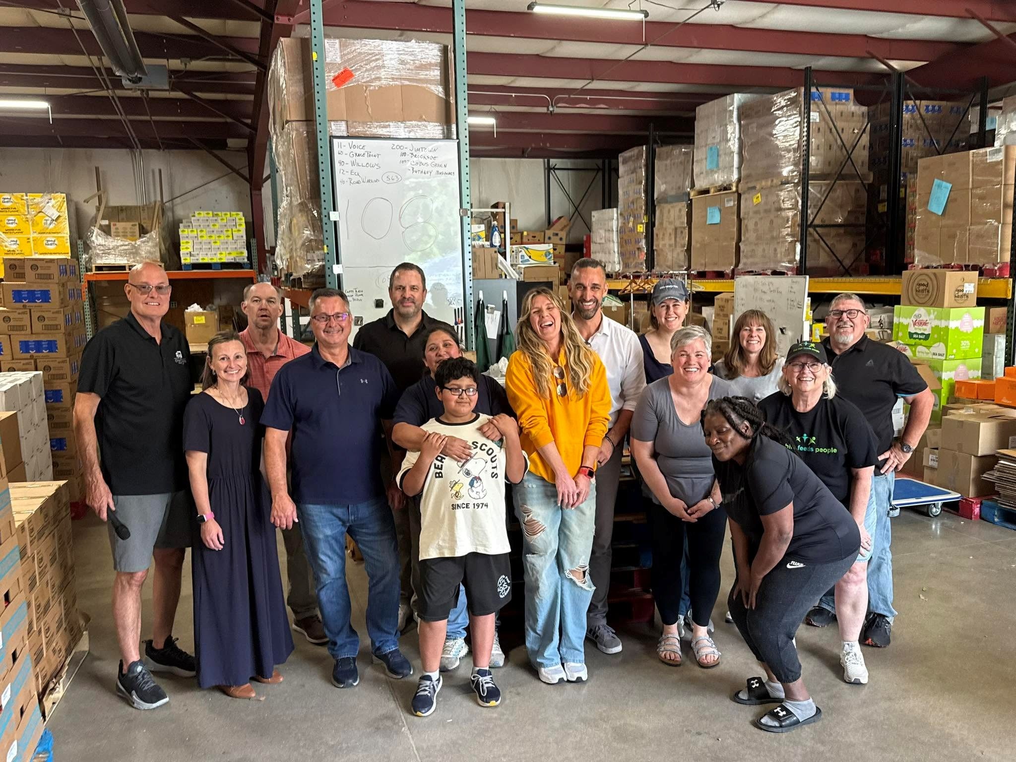 Volunteers at the warehouse gather supplies.