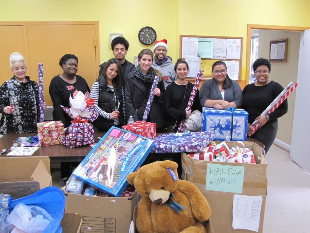 Volunteers wrap the gifts.