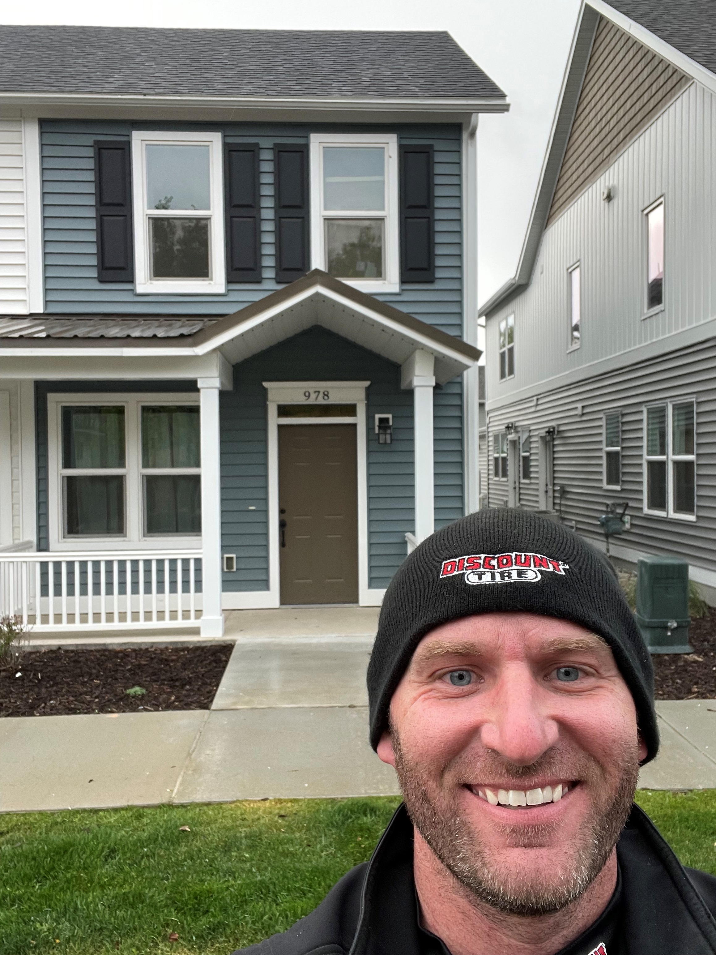 Dawson Bowcut in front of his home.