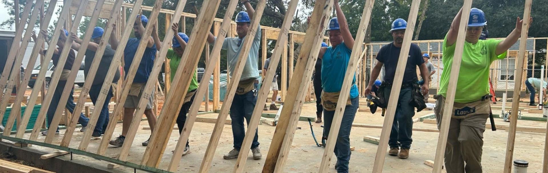 The community comes together to build a home.