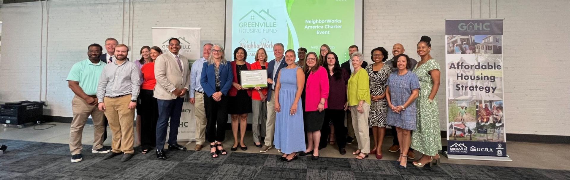 A gathering of staff and legislative representatives at the chartering ceremony for Greenville Housing Fund.