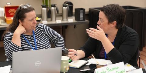 Nora Cronin and her CEO discuss possibilities during a boot camp meeting.