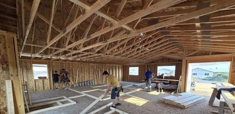 A crew works on building a home.