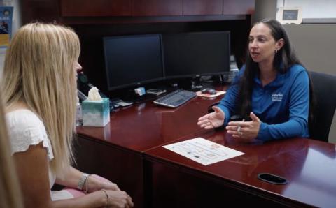 Estelle and Pam meet to discuss a housing plan.