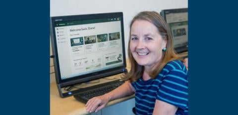 A photo shows a woman at a computer, ready to learn.