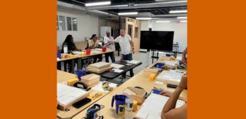 A photo shows learning taking place in a classroom.
